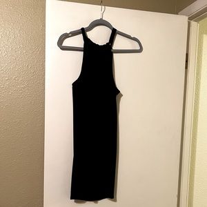 Black dress, loose fitted, ties in the back.